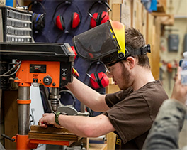 Student With Drill Press